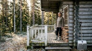 Finnish log cabin with forest background